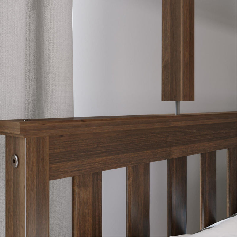 Dark wood slatted headboard with modern wooden bedside lamp and neutral textured curtain in a minimalist bedroom