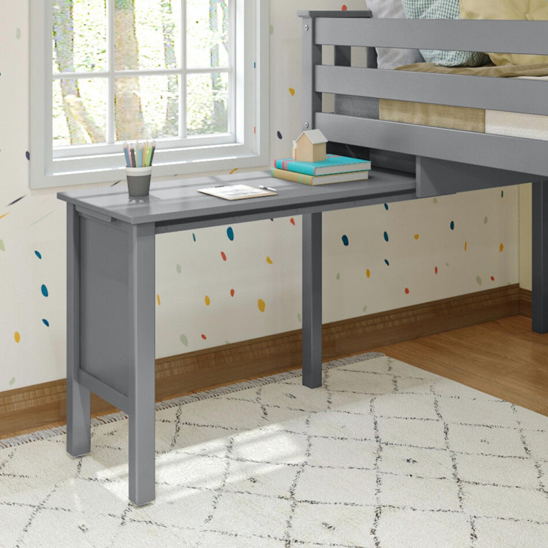 Gray children's study desk with pencils and books next to a window in a colorful bedroom.