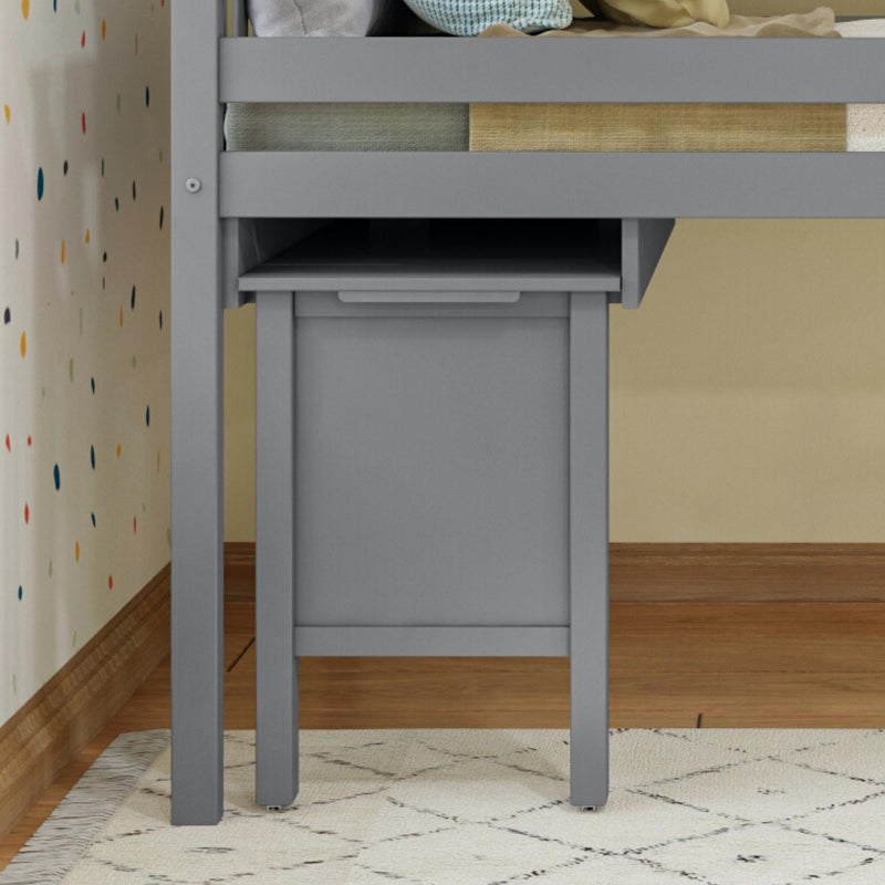 Gray storage furniture under loft bed with polka dot wall decor and geometric rug.
