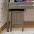 Modern wooden loft bed with colorful heart-patterned wallpaper in cozy children's room.