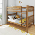 Modern natural wood bunk bed with ladder and slatted rails in bright kids' bedroom, gray bedding, yellow accent pillows and brass wall sconce