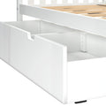White wooden single bed frame with slatted base and open under-bed storage drawer, modern children's bedroom furniture