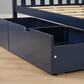 Navy blue wooden platform bed with slatted frame and built-in under-bed storage drawer with cutout handle on hardwood floor