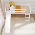 White wooden loft bed with slide, ladder, and cozy bedding in a modern children's room.