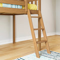 Wooden loft bed ladder in modern kids bedroom with hardwood floor, yellow pillow and blue patterned blanket