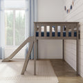 Neutral nursery with wooden kids' loft bed and slide, navy bedding, white shiplap wall and large window with sheer curtains