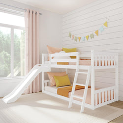 White wooden kids bunk bed with slide and ladder in bright children's bedroom with pastel bedding, pink curtains, shiplap walls and bunting garland