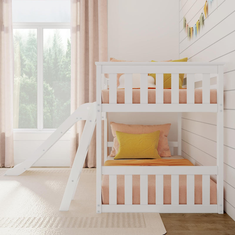 White wooden bunk bed with slide in a bright children's room featuring peach curtains and pillows.