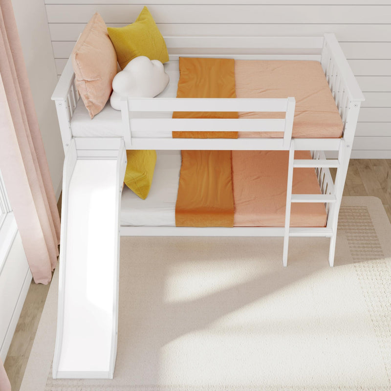 Children's white bunk bed with slide, featuring orange and yellow bedding and a cloud pillow in a bright room.
