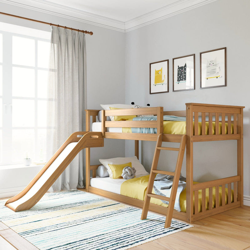Wooden bunk bed with slide in modern kids' room featuring yellow bedding and playful wall art.