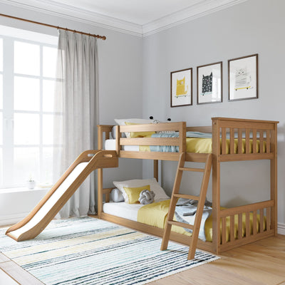 Modern wooden kids bunk bed with slide and ladder in bright children's bedroom, yellow bedding and knit throw, framed cat prints on gray wall, large window with sheer curtains