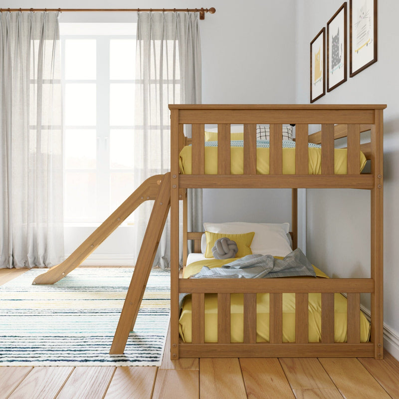 Wooden bunk bed with slide in children's room featuring yellow bedding and natural light.