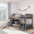 Modern gray wooden twin-over-twin bunk bed with slide and ladder in bright children's bedroom featuring blue bedding, shiplap wall, and window curtains