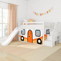 White kids loft bed with slide and staircase storage, camper-themed play tent curtain and flower pillow in a bright modern nursery