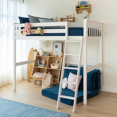 White loft bed with ladder over cozy reading nook and storage in bright children's room.