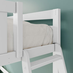 Close-up of white wooden loft bed ladder and safety guardrail with quilted white bedding against a teal wall background