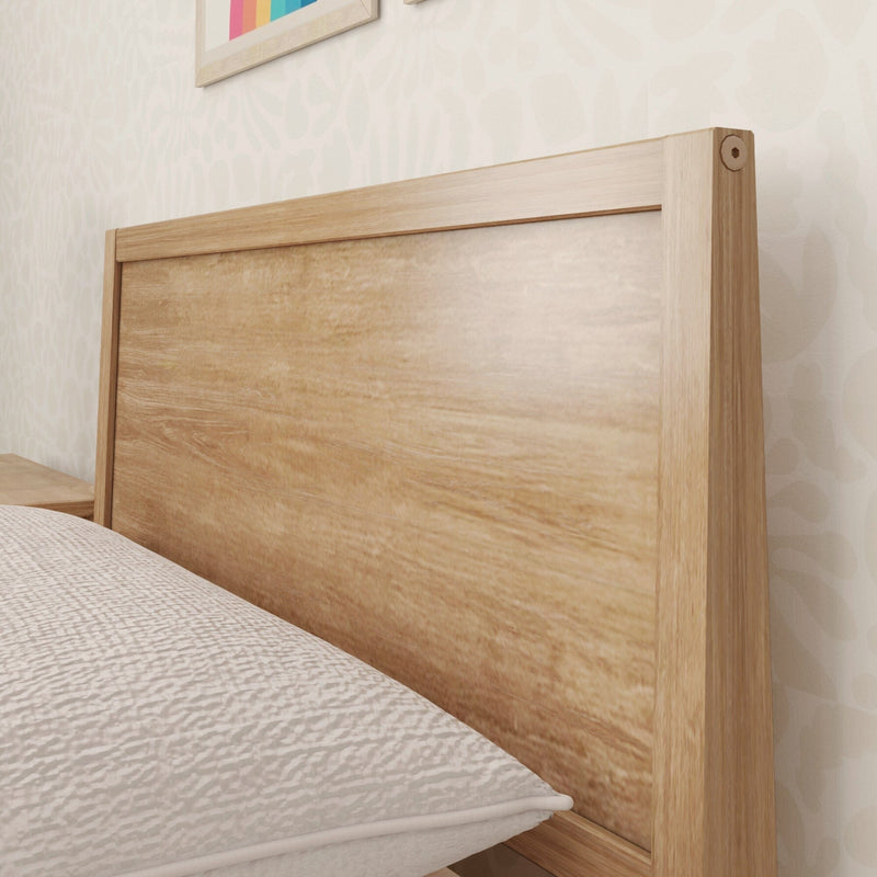 Wooden bed headboard with natural finish in a modern bedroom setting.