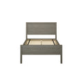 Modern wooden bed frame with slatted base against a white background.