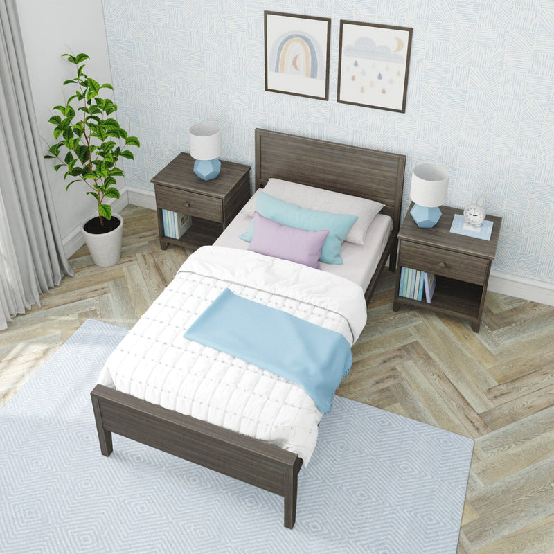 Modern bedroom interior with a sleek gray bed, colorful pillows, and stylish decor.