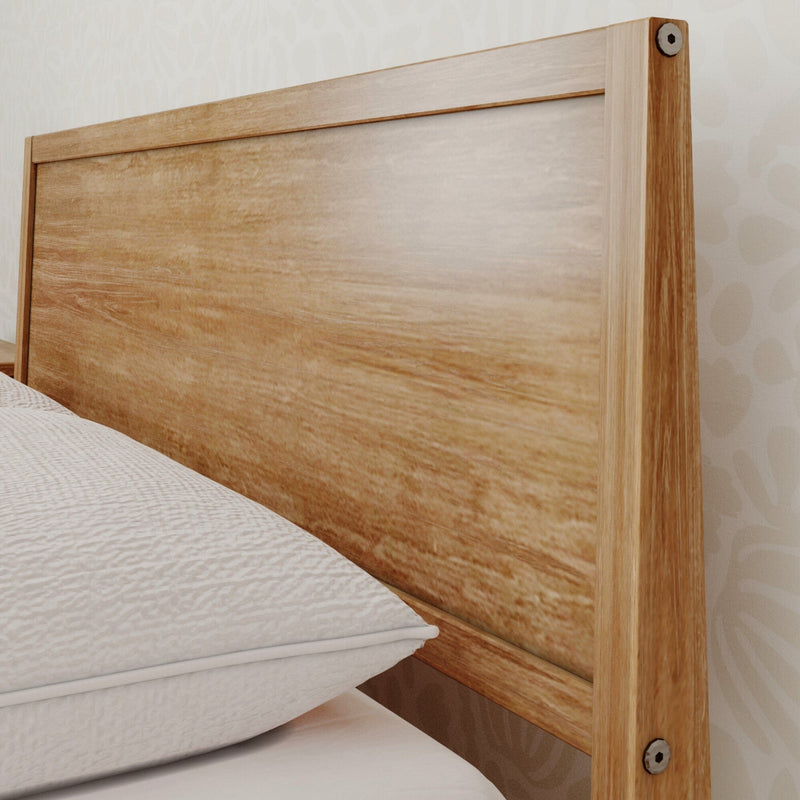 Wooden bed headboard with natural finish in a modern bedroom setting.