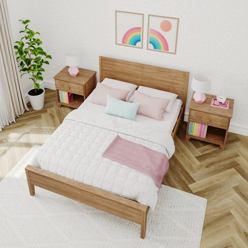 Cozy bedroom with wooden furniture, pink and white bedding, and decorative wall art.