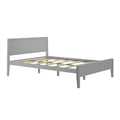 Modern gray wooden platform bed frame with slatted base and rectangular headboard, minimalist low-profile bedroom furniture