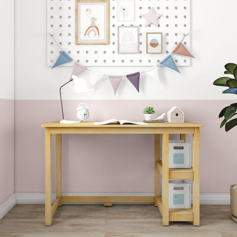 Kids study desk with decorative wall art and accessories in a pastel-themed room.