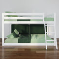 White wooden loft bunk bed with ladder and green gingham bedding in a modern kids bedroom interior