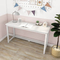 Modern white minimalist writing desk in pink and white kids' room with lamp, alarm clock, open notebook, succulent, wooden birdhouse, pennant banner and potted plant on light wood floor