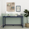 Modern navy blue desk in a pastel green and white kids' study room with wooden pegboard shelves, rainbow wall art, desk lamp, organizer and potted plant