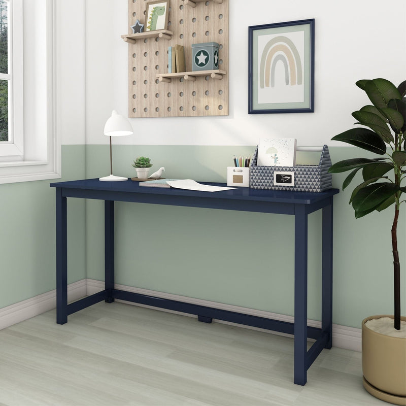 Navy blue slim console desk in a bright small home office or kids study nook with mint green half-painted walls, light wood pegboard shelves, desk lamp, stationery organizer and potted plant, modern minimalist Scandinavian style