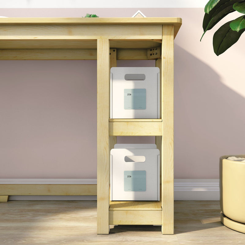 Home office wooden desk shelf with two white storage boxes labeled "notes" for organized workspace, pink wall and potted plant