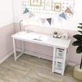 White modern study desk with side storage shelves, lamp, alarm clock, open notebook and succulent under pegboard wall bunting in pastel pink kids room