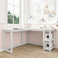 White L-shaped corner desk with two open storage shelves in a pastel pink children's bedroom, minimalist study desk by window for small spaces
