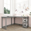 Modern grey L-shaped corner desk with built-in shelves in sunlit pink and white study nook, pegboard wall and bunting