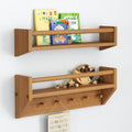 Wooden wall shelves with children's books and toys for nursery organization.