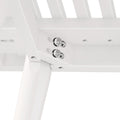 Close-up view of a white metal bunk bed frame corner with visible screws and slats, showcasing sturdy construction and modern design.