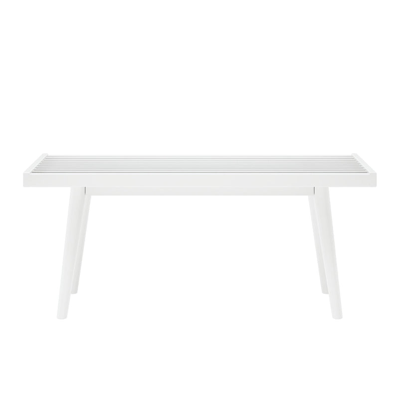 White minimalist bench with slatted design and tapered legs.