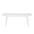 White minimalist bench with slatted design and tapered legs.