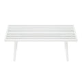 Modern white slatted outdoor coffee table with minimalist design.