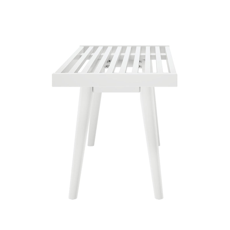 White slatted wooden bench with angled legs in modern minimalist design.