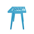Blue wooden bench with slatted seat and modern design.