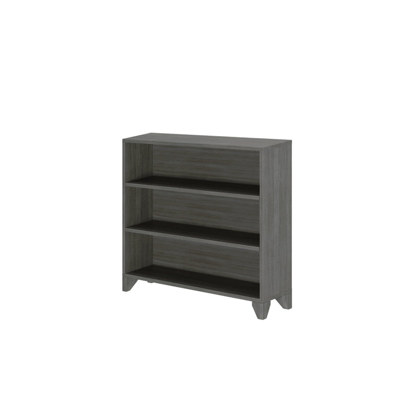 Gray wooden bookshelf with three shelves for home or office storage.