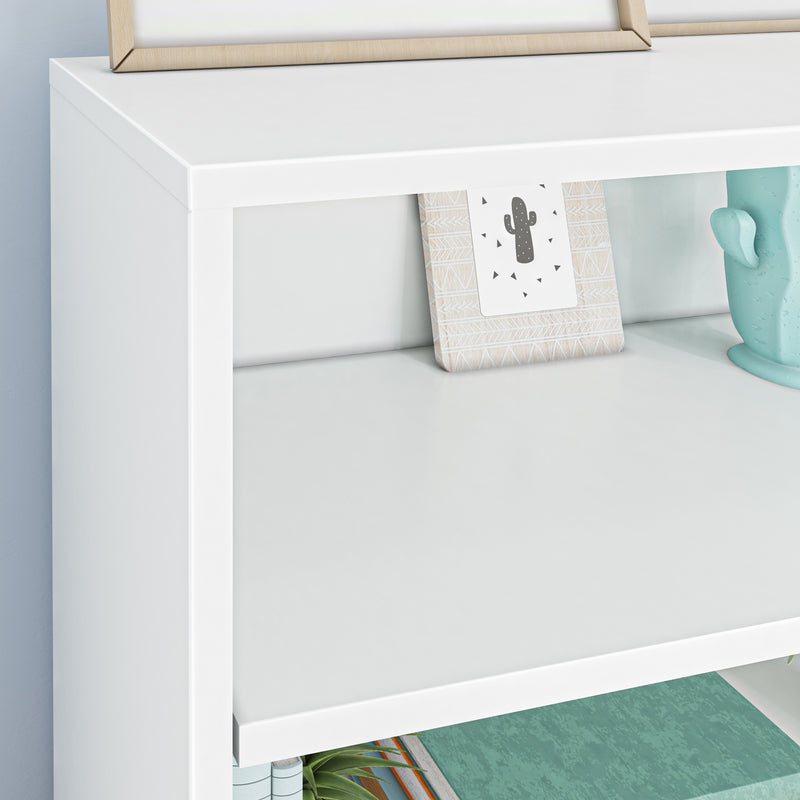 White modern shelf styled with turquoise cactus planter, framed cactus print, and stacked books for minimalist home decor