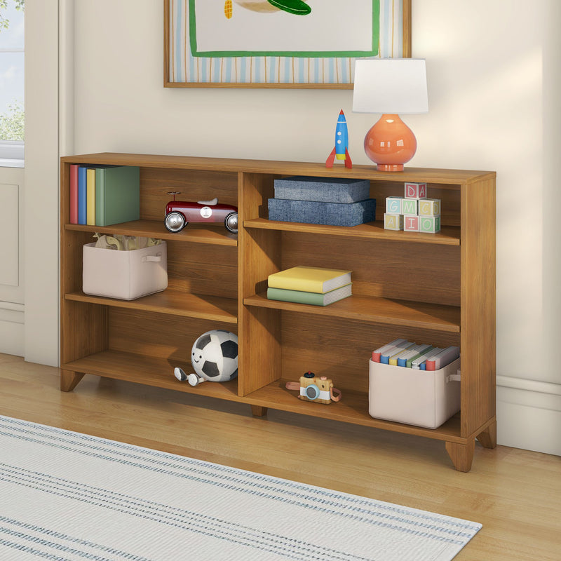 Wooden kids' bookshelf and toy storage in a bright nursery with lamp, toy rocket, stacking blocks, books, and plush soccer ball