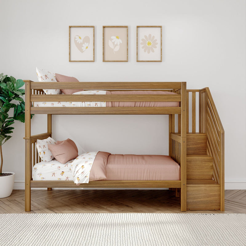 Wooden bunk bed with pink bedding and stairs in a stylish kids' bedroom with wall art and plant.