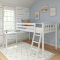White loft bed with ladder and built-in desk in a coastal kids' room with blue wave wallpaper, framed surf-van art and sunny window