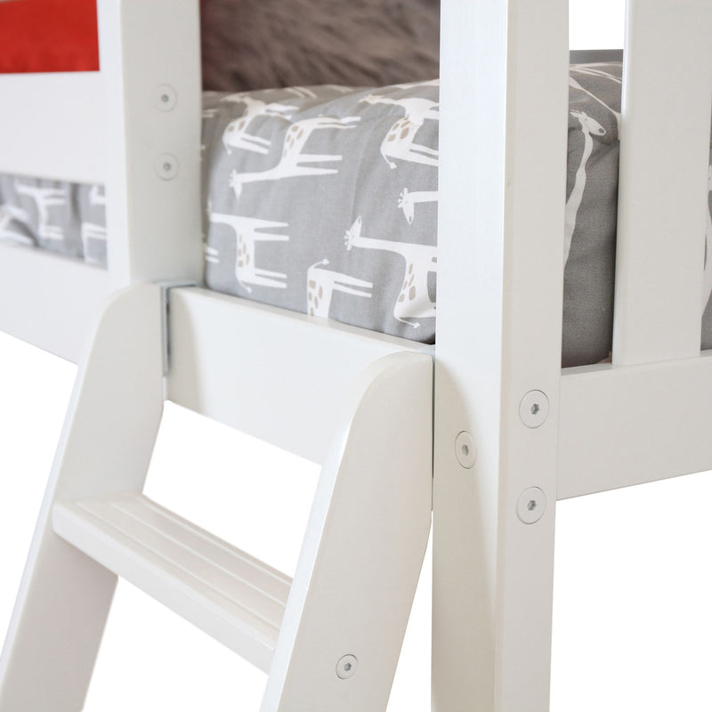White wooden ladder of a children's bunk bed with giraffe-patterned bedding.