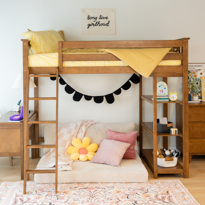 Wooden loft bed with yellow bedding and cozy seating area underneath featuring pink and flower pillows, perfect for a girl's room decor.