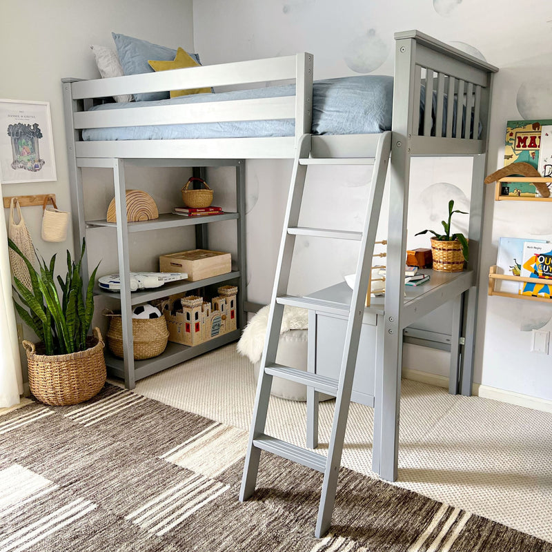 Gray loft bed with ladder and desk in a kid's room with decorative shelves and plants.